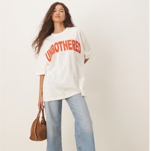 ASOS DESIGN oversized T-shirt with unbothered slogan graphic in cream